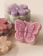 Pastel flower and butterfly-shaped handmade soaps